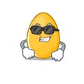 Super cool golden egg character wearing black glasses