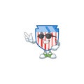Super cool USA stripes shield mascot character wearing black glasses Royalty Free Stock Photo