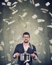 Super excited man with boil pan under money dollar bills rain Royalty Free Stock Photo