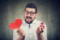Super excited man with red heart shape wedding ring box Royalty Free Stock Photo