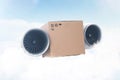 Super express delivery, future concept. Packing cardboard box with airplane turbines flies in the sky with clouds. Delivery of