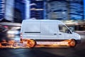 Super fast delivery of package service with van with wheels on fire. Royalty Free Stock Photo