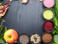 Super food health food selection in bowls, spirulina, berry powder, black cumin, pumpkin and sunflower seeds, sesame, flex seeds, Royalty Free Stock Photo