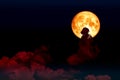 super full blood moon back over silhouette cloud night sky Royalty Free Stock Photo