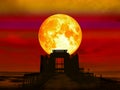super full blood moon over abandon temple in the sea Royalty Free Stock Photo