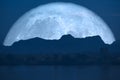 super full fish moon back on cloud and mountain on night sky