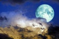 super full harvest blue moon back on silhouette cloud on sunset sky Royalty Free Stock Photo