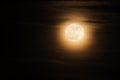 Super full moon known as a supermoon with soft clouds Royalty Free Stock Photo