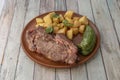 Super grilled beef entrecote with fried green pepper and garnish of diced fried potatoes