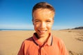 Close face portrait of a boy smile on the beach Royalty Free Stock Photo