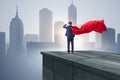 The super hero businessman on top of building ready for challenge Royalty Free Stock Photo