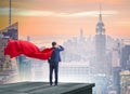 Super hero businessman on top of building ready for challenge Royalty Free Stock Photo