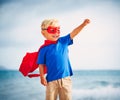 Super Hero kid with a mask flying Royalty Free Stock Photo