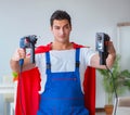 Super hero repairman working at home Royalty Free Stock Photo