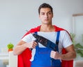 Super hero repairman working at home Royalty Free Stock Photo