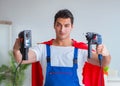 Super hero repairman working at home Royalty Free Stock Photo