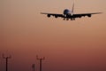 Super jumbo, plane landing at sunset