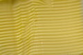 Super macro horizontal lines in margarine, made by a serrated knife