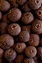 Super macro shot of allspice dry pepper in detail very close. food spice background.