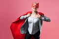 Super Manager, funny superhero. Female power, the girl in the mask of the hero and the red cloak, Royalty Free Stock Photo