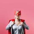 Super Manager, funny superhero. Female power, the girl in the mask of the hero and the red cloak,