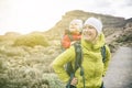 Super Mom with baby boy hiking in backpack Royalty Free Stock Photo