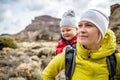 Super Mom with baby boy hiking in backpack Royalty Free Stock Photo