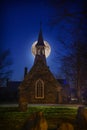 A super moon above the Anglican stone-field church, St. Peter`s of Cookshire-Eaton in Estrie, Quebec, Canada Royalty Free Stock Photo