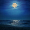 Super moon in clouds over sea Royalty Free Stock Photo
