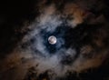 Super moon on a dark, cloudy sky on March, 9th 2020 Royalty Free Stock Photo