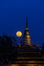 Super moon in night sky and silhouette of ancient pagoda is named Wat Ratchaburana, Phitsanulok in Thailand Royalty Free Stock Photo