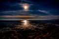 Super Moon setting on the Beach Royalty Free Stock Photo