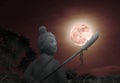 Super pink moon with statue silhouette