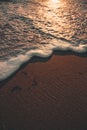 A super sharp tide over the sand of a beach