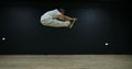 Super slow motion free running acrobat in the gym shot on 300fps 4K