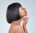 Super smooth and soft to the touch. Studio shot of an attractive young woman posing against a grey background.