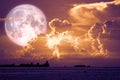 super snow moon back on sunset sky silhouette cloud on sea Royalty Free Stock Photo