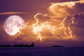super snow moon back on sunset sky silhouette cloud on sea Royalty Free Stock Photo