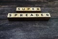 Super Spreader word letter on wooden background Royalty Free Stock Photo