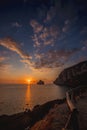 Super sunset in the south of sardinia in front of the stack of sugar loaf