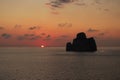 Super sunset in the south of sardinia in front of the stack of sugar loaf