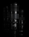 Super telephoto lenses on a black background. The NIKKOR Z 180-600mm f 5.6-6.3 VR in the foreground. Professional photo