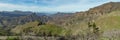 Super wide panorama. Aerial view of the center of Gran Canaria. Famous Bentayga rock in huge caldera and Tenerife above the Royalty Free Stock Photo