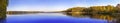 Super wide panorama Autumn landscape of idyllic reflections of sky in water pond Royalty Free Stock Photo