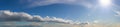 Super wide sky panorama with clouds and sunshine Royalty Free Stock Photo