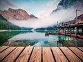 Superb morning view of Braies Pragser Wildsee lake with wooden pier. Perfect summer scene of Fanes-Sennes-Braies national park, Royalty Free Stock Photo