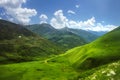 Superb mountain landscape. Green meadows on the high hills in Georgia, Svaneti region. View on grassy highlands