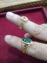 Superb Rings of Emrald and yellow saffire in gold Royalty Free Stock Photo