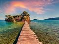 Superb summer sunrise on Port Sostis, Zakinthos island, Greece, Europe. Wooden footbridge to Cameo Island. Beauty of nature conce