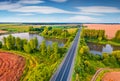 Superb summer sunrise on Ternopil outskirts with two lakes and asphalt road on the midle Royalty Free Stock Photo